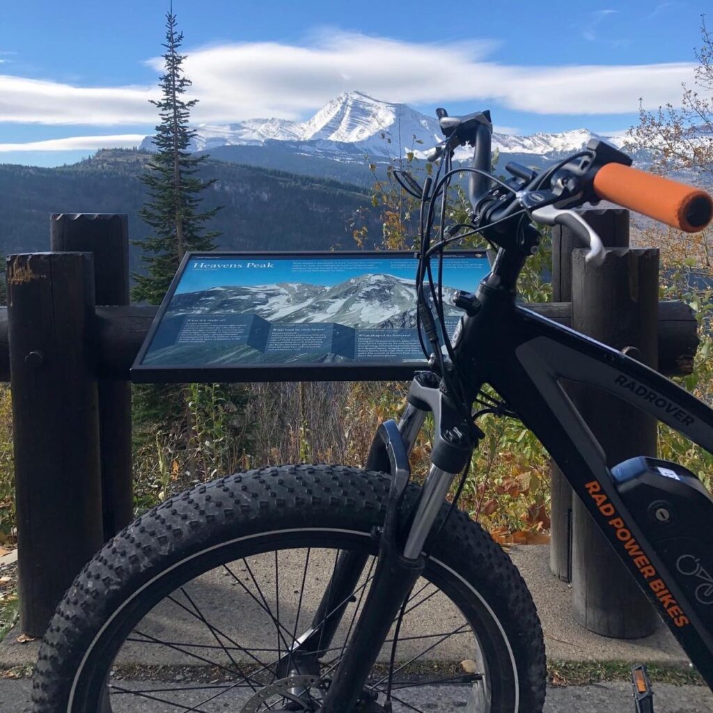 Perfect e-bike picture with sign and peaks (1)