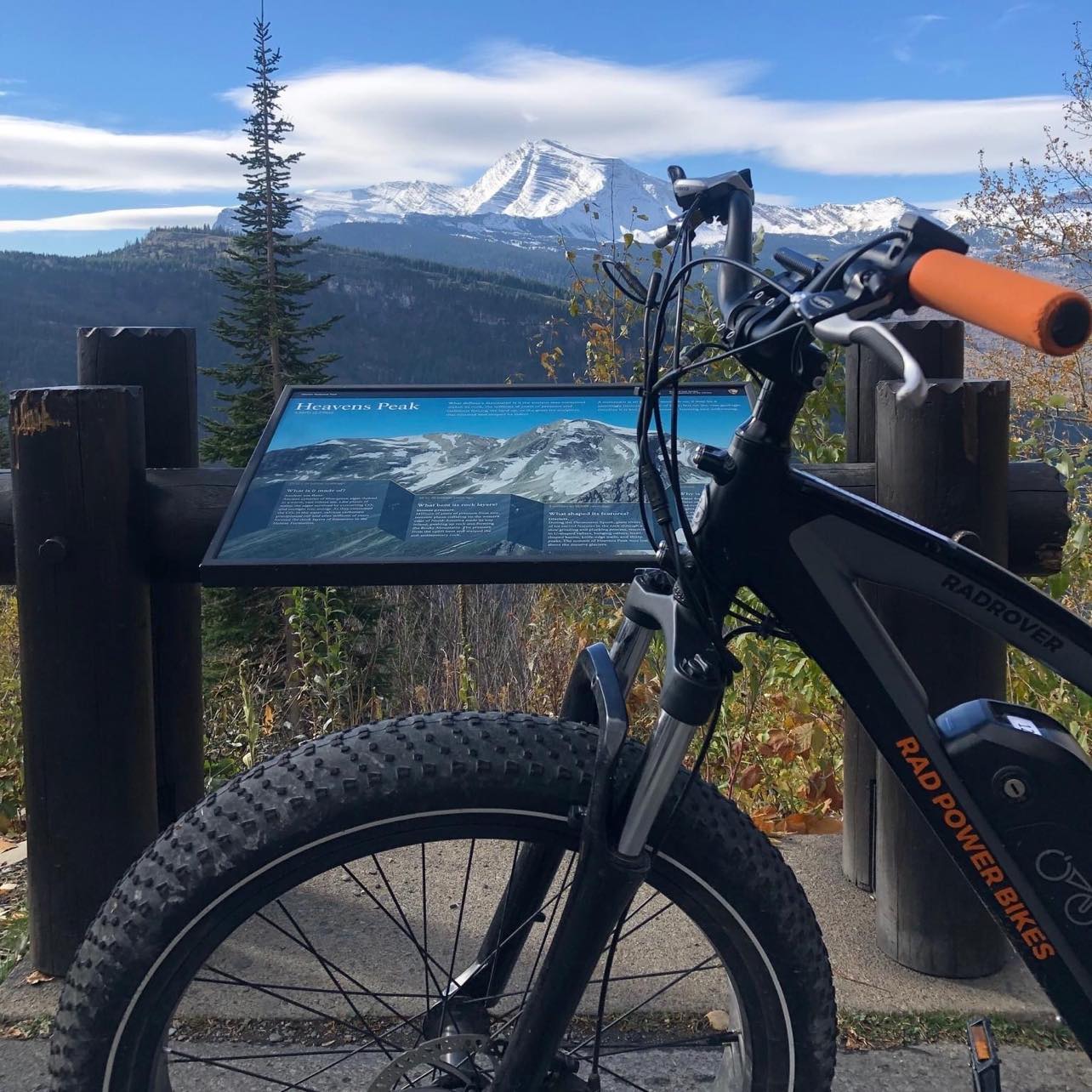 Perfect e-bike picture with sign and peaks (1)